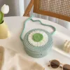 A fashionable clutch bag decorated with colorful woven round small bags featuring flower cartoon dolls details Picture